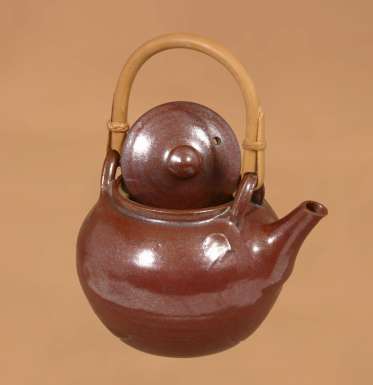 Teapot with cane handle by Winchcombe Pottery